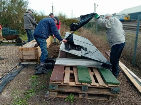 Photo of removing covering from solar panels